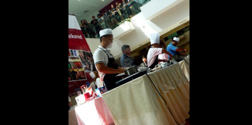 CHEFS IN ACTION: Participants concentrating on completing their pasta within the given time frame.