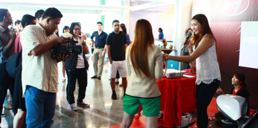  CROWD-PULLER: UCSI University students, staff and visitors gathering in front of the stage in hopes of winning a prize during the Hyundai “Veloster Challenge.”