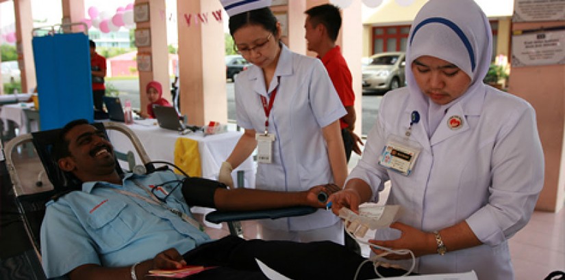 A patron donating blood during the Campaign