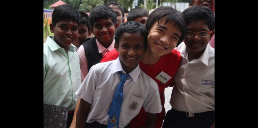 UCSI University student, Hao Han from China gets acquainted with the local primary school students